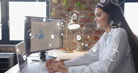 When typing on laptop, analyst taking notes in office with animated data icons fading for reporting - Powered by Adobe