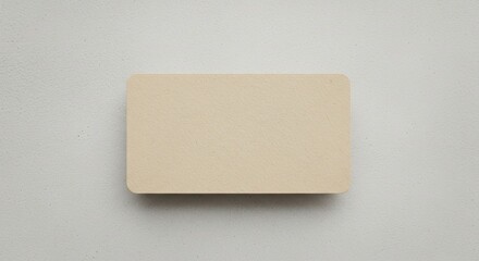 Beige Card on Textured Gray Background.