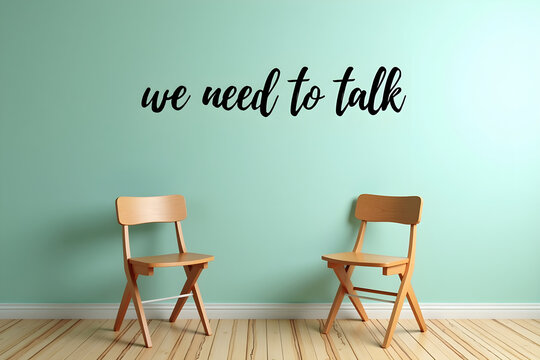photo of two wooden chairs in a room with a teal green wall, "we need to talk" text overlaying the image, wooden floor, minimalist, cozy, intimate setting, digital art