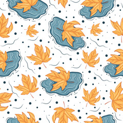 Naklejka premium seamless pattern with autumn leaf from a deciduous tree lying in a blue puddle of water, for autumn printing, packaging or other designs