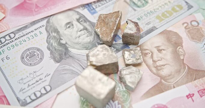 Critical minerals and rare earths, China - US trade truce, strategic mineral leverage : Metallic ores (representing critical minerals like gallium, germanium) resting atop U.S. dollar and Chinese yuan