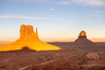 Monument Valley Buttes at Sunset with Moon in Sky Navajo Nation tribal park