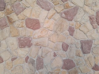 Background of stone wall texture photo in brown and red colors