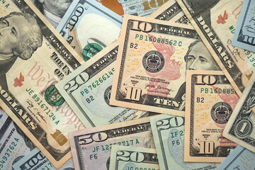 Big amount of different dollar bills close up. Hundred fifty twenty ten and five dollar banknotes