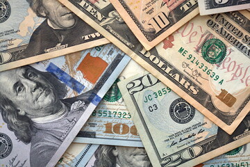 Big amount of different dollar bills close up. Hundred fifty twenty ten and five dollar banknotes