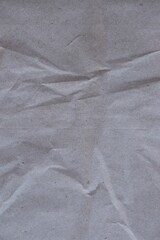 Naklejka premium Brown crumpled recycled paper texture background. Kraft Paper