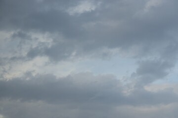 Blue sky with scattered white cumulus clouds