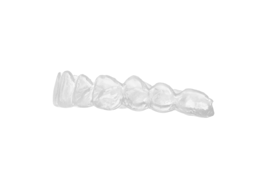Transparent dental mouth guard for orthodontic treatment and bruxism prevention, clear plastic teeth aligner with detailed tooth impressions isolated on white background, professional closeup shot