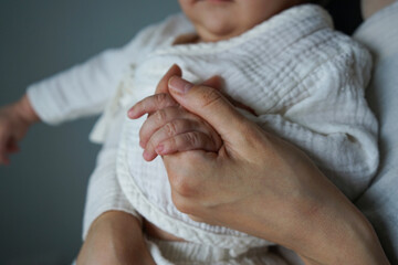 Small hand touching parent?s hand close-up