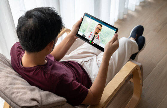 Doctor video call online by modish telemedicine software application for virtual meeting with patient
