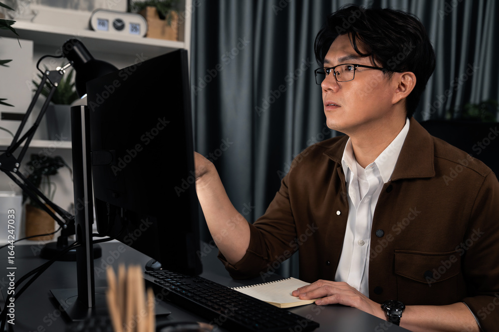 Poster smart businessman pointing computer to check business data report on sales target revenue over late 