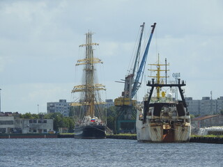 Cargo ship and the tall ship Kruzenshtern in the port of Kaliningrad