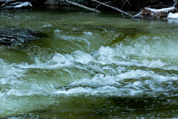 Small, icy rapids in the Sugar River in New Hampshire.
