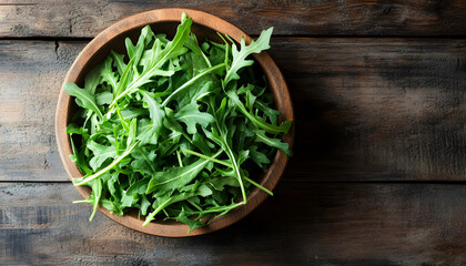 Fresh ripe green arugula leaves on wooden table, closeup. Space for text