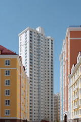 Fototapeta premium modern architectural facades without people featuring strikingly colorful residential complexes