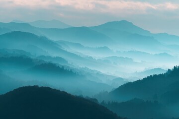 Fototapeta premium Misty mountain landscape at dawn with layered atmospheric depth.