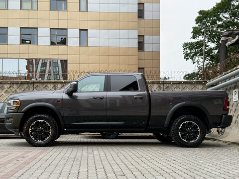 Grey Dodge Ram TRX 2500 parking at the city street. Powerful American pickup Dodge Ram TRX on parking lot. Exterior of the grey color Dodge Ram TRX 6.2 supercharge. 