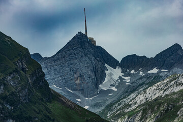 Majestic view of Santis mountain peak in the Swiss Alps, featuring the iconic transmission tower,...