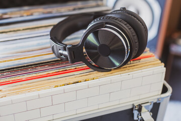 DJ Headphones Resting on Stack of Vintage Vinyl Albums – Analog Audio Vibe