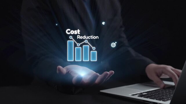 A businessman highlights cost reduction strategies with digital analytics and graphs, showcasing a modern approach to financial management and business efficiency. Qubit