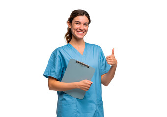 Young woman nurse in blue scrubs holding clipboard and giving thumbs up on transparent background, PNG