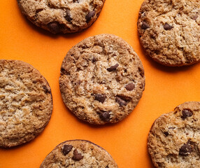 chocolate chip cookies on an orange background
