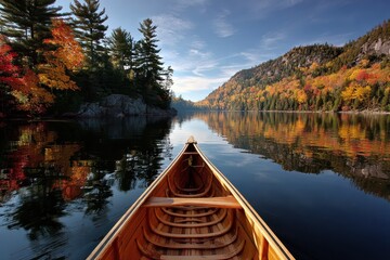 Fototapeta premium Canoe Bow on Tranquil Lakefront: A Scenic Wilderness Landscape in Autumn
