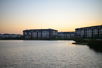 sunset over the apartment complex lake