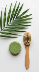 Photo of natural green soap bar and wooden brush isolated on white background