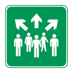 A green sign showing white figures and arrows pointing in different directions for evacuation guidance