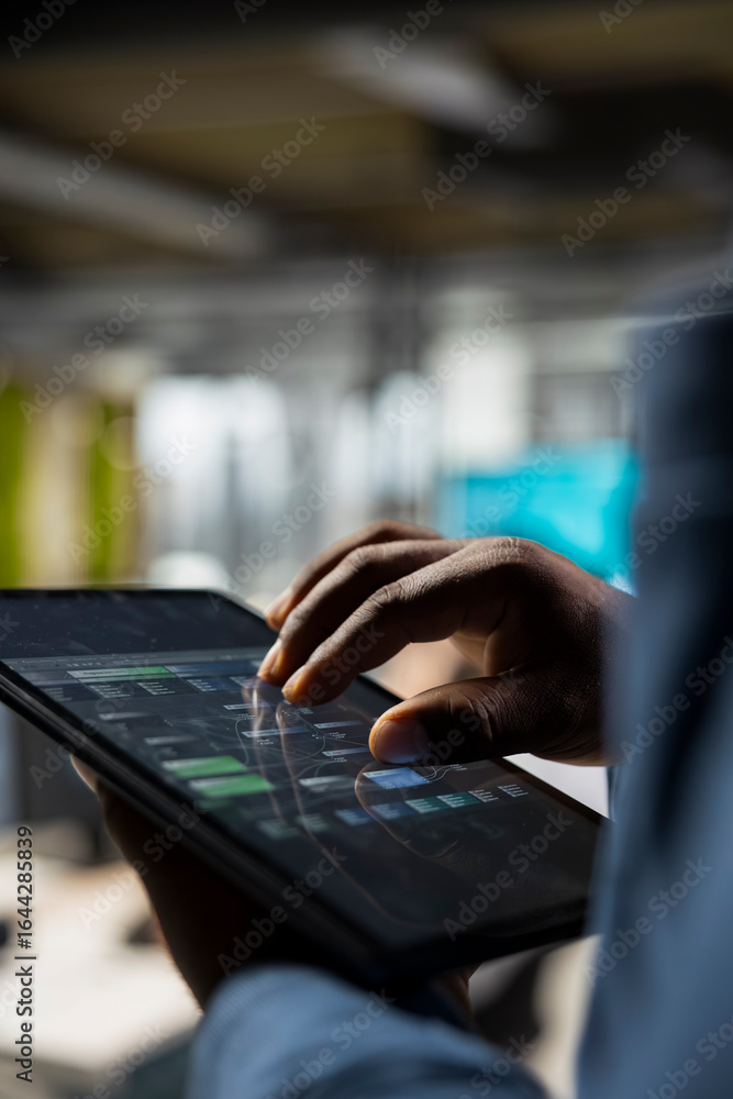 Poster close up of analyst focused on charts analysis on tablet to ensure expansion for it company, reviewi