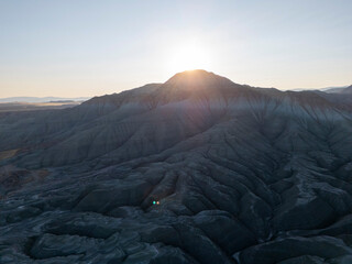 Nallıhan features a dramatic sunrise illuminating a rugged mountain range with deep valleys and...