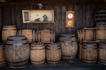 Rustic Wooden Barrels and Wall Clock in a Winery Setting