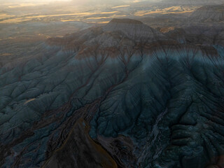 Aerial view of dramatic colorful mountains with layered textures, unique geological formations and...