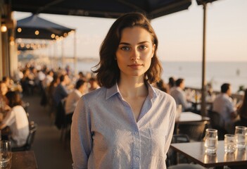 Beach cafe manager overseeing dining operations with a coastal view