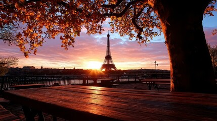 A serene view of the Eiffel Tower at sunset framed by autumn leaves and a rustic wooden table, capturing the beauty of Paris