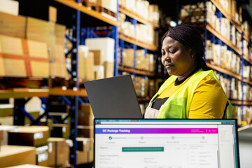 African american depot employee manages a shipping depot with packages ready for delivery. Staff...