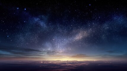 Fototapeta premium Night sky reveals milky way galaxy shines above horizon with clouds glowing from distant light