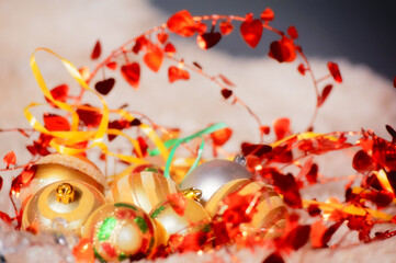 a bright New Year's composition of Christmas tree balls and holiday decor. In the center are...