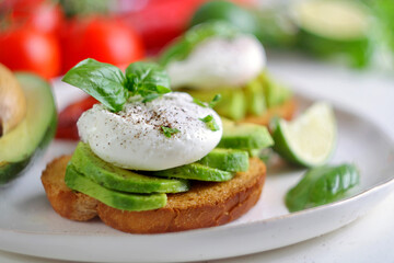 Sliced avocado and poached egg on toasted bread