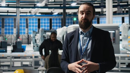 Business owner and visionary speaker presents a clean energy strategy at solar plant for production...