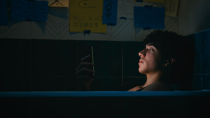 Sad Man Hypnotized By The Light Of His Smartphone