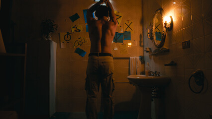 Man Using The Rope To Simulate Suicide In The Bathroom