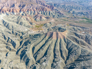 Nallıhan's stunning aerial view captures colorful ridges and eroded landforms shaped by natural forces over time. A perfect fit for geological, environmental, or travel-related visuals.