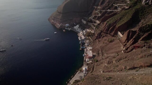 Pan up to ocean and cliffside architecture 4K