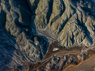 Overhead view of eroded sedimentary formations in Nallıhan, Turkey. The intricate textures and...