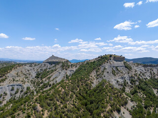 Aerial view of Asarlık Hills in Nallıhan, Ankara, featuring rocky slopes covered with green trees...