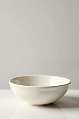 Textured off-white ceramic bowl, minimalist design, empty , textured, rustic