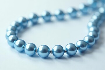 Obraz premium Elegant blue pearl necklace, lustrous beads on pristine white , gemstone, beads