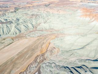 Fototapeta premium Aerial view of the vibrant Rainbow Hills in Nallıhan, showcasing unique geological patterns and colorful terrain, highlighting the natural beauty and striking landscape of this Turkish region.